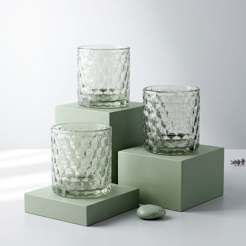 260ml Textured Clear Glass Candle Jar with Custom Gift Box 3 260ml textured glass candle jars displayed on green pedestal blocks