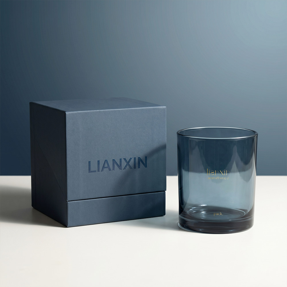 430ml smoky blue glass candle jar beside navy luxury gift box