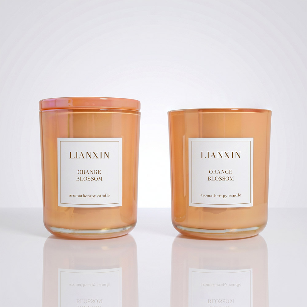 Two 620ml glass candle jars with custom labels
