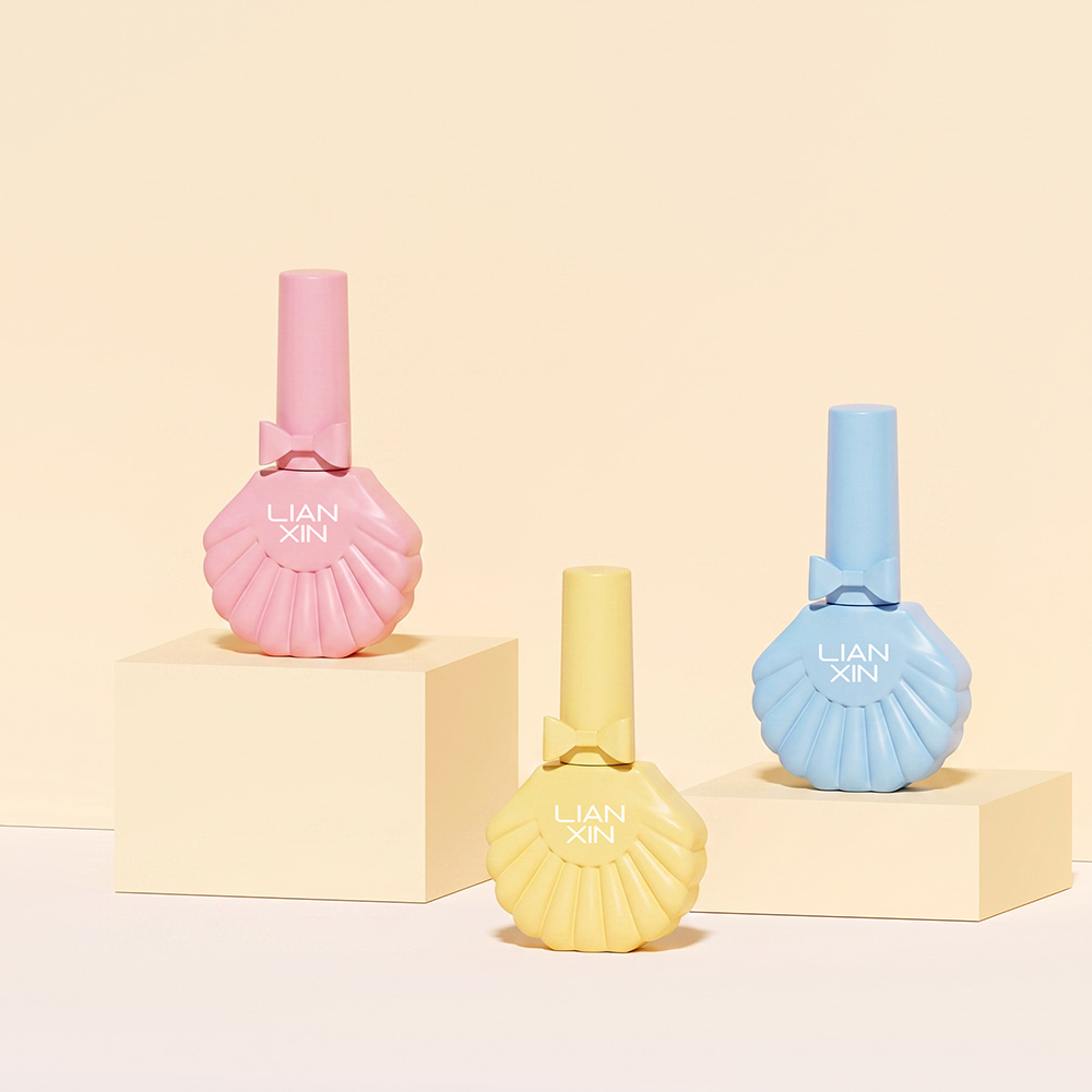 18ml Shell Shaped Glass Nail Polish Bottle with Brush Cap 2 18ml shell nail polish bottles in pastel pink, yellow and blue with bow caps