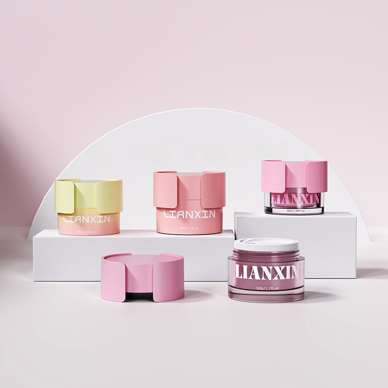 Pink 30g and 50g luxury plastic face cream jars with removable decorative caps