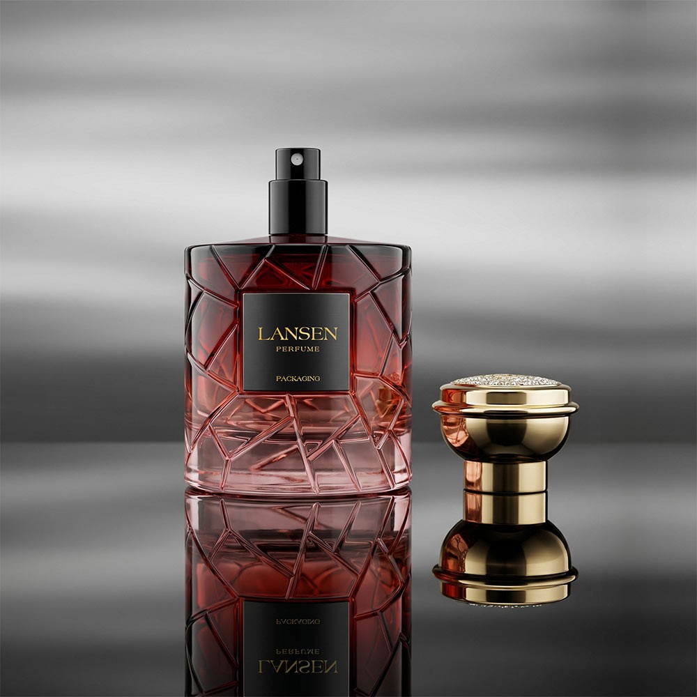 100ml crystal cut perfume bottle with the sprayer exposed and the gold plated cap standing separately beside it