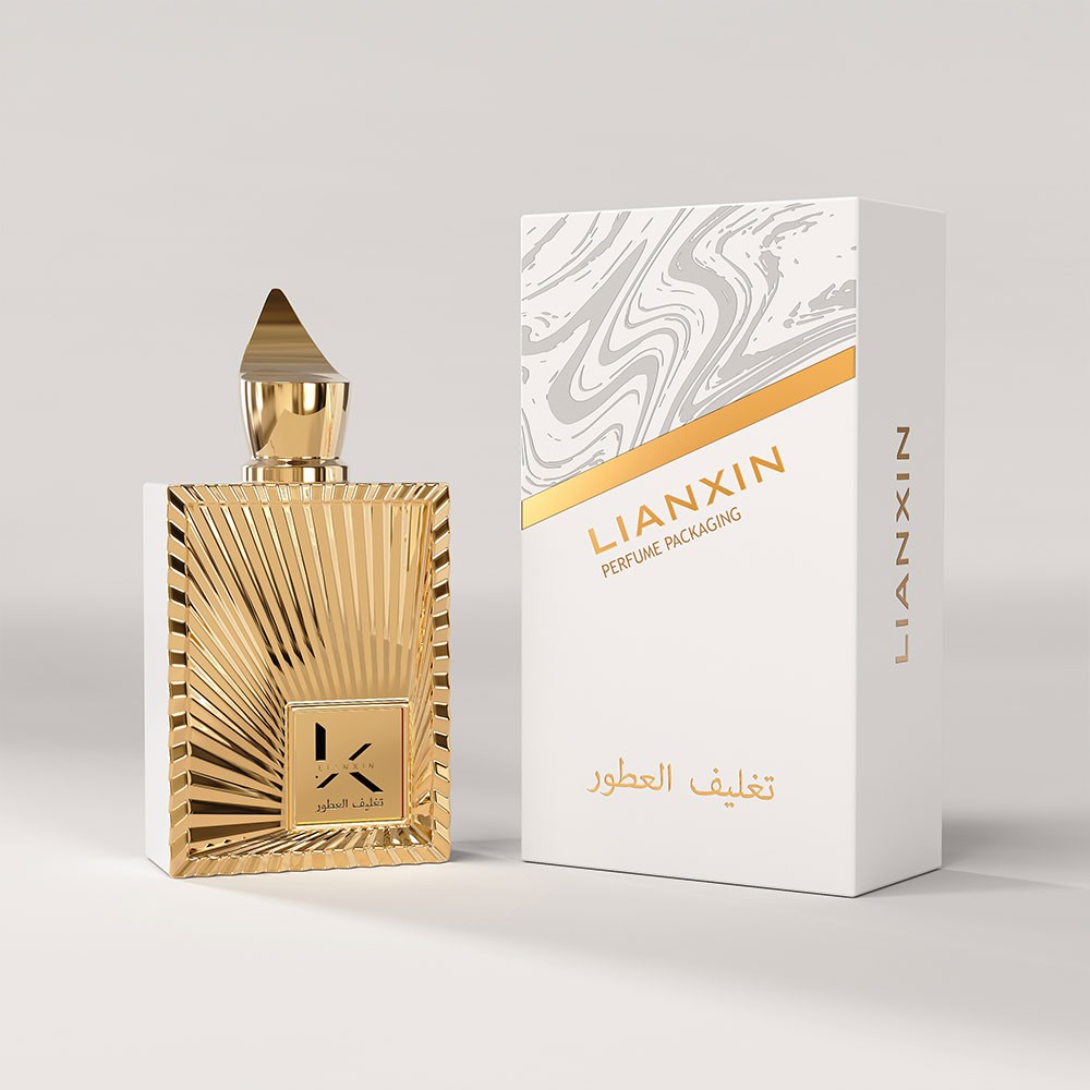 100ml luxury gold rectangular glass perfume bottle with sunburst ray relief beside its white and gold gift box
