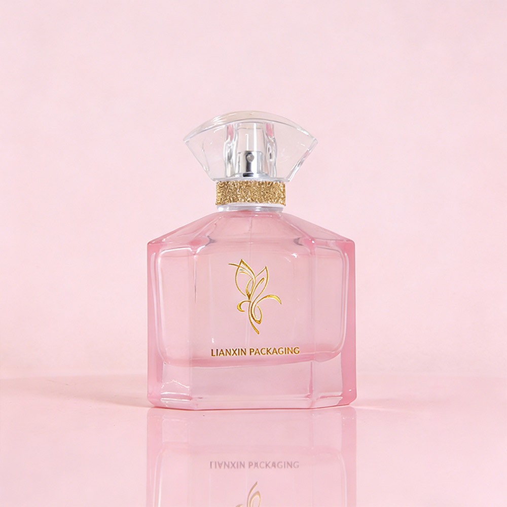 110ml chamfered corner glass perfume bottle in translucent pink with a clear fan cap and a gold textured band