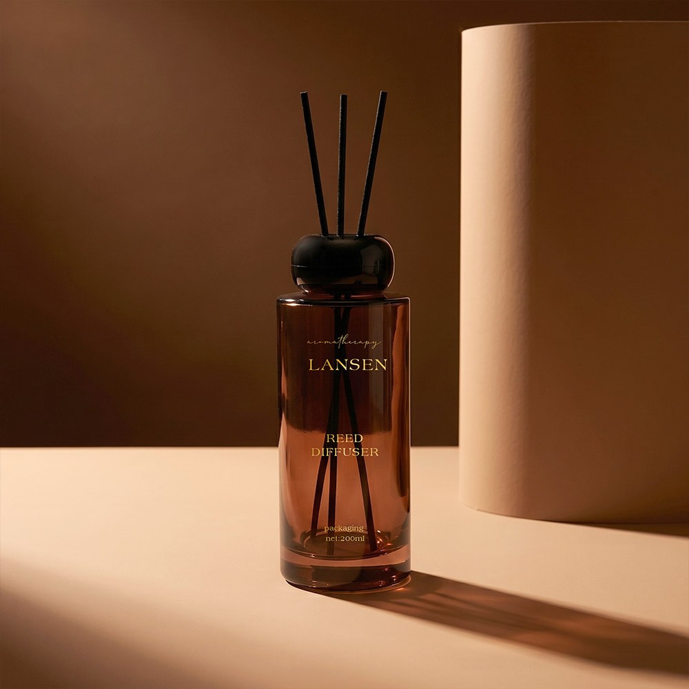 200ml long cylindrical amber glass reed diffuser bottle with glossy black ball cap and reeds