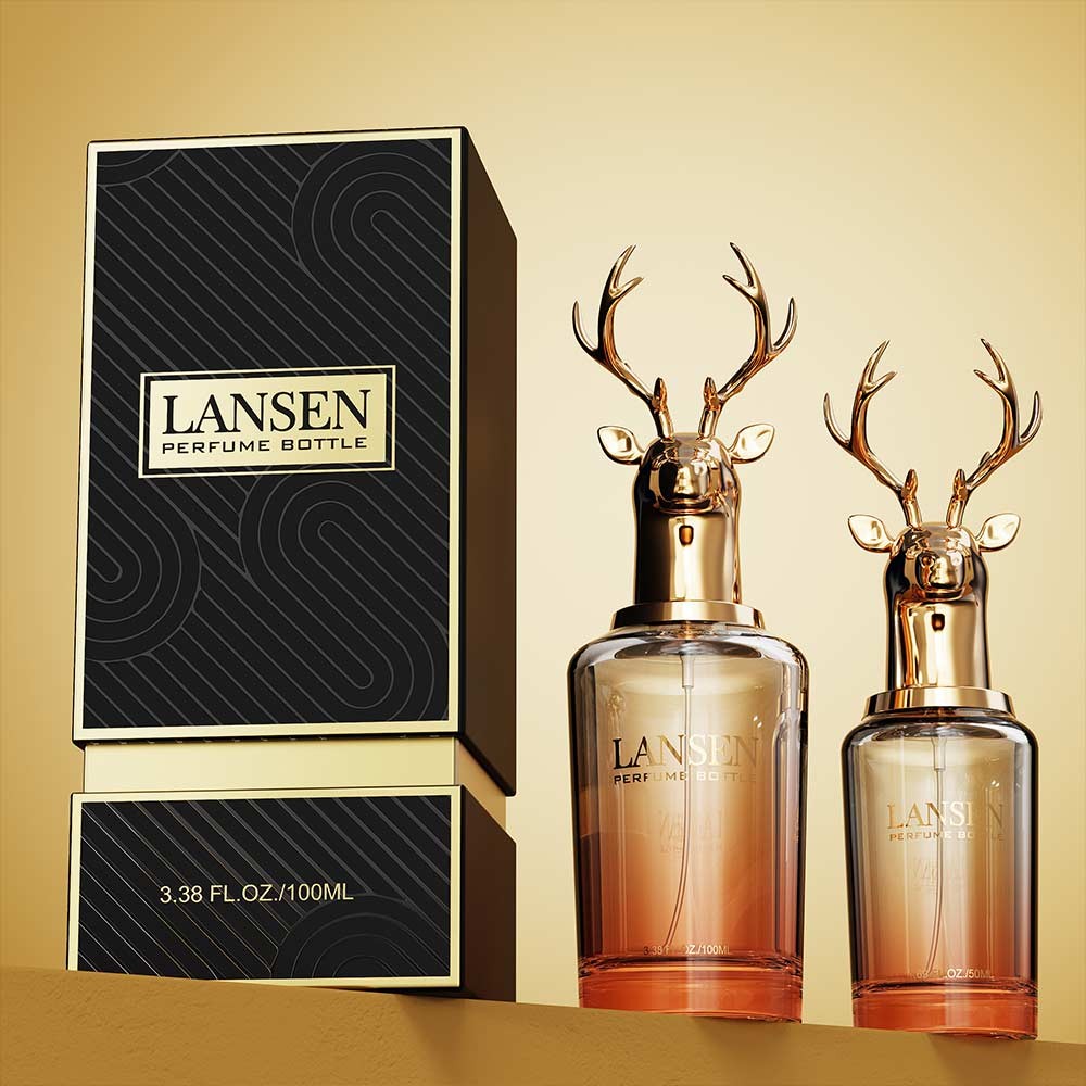50ml and 100ml deer head perfume bottles in amber gradient glass with gold stag caps and a black and gold gift box