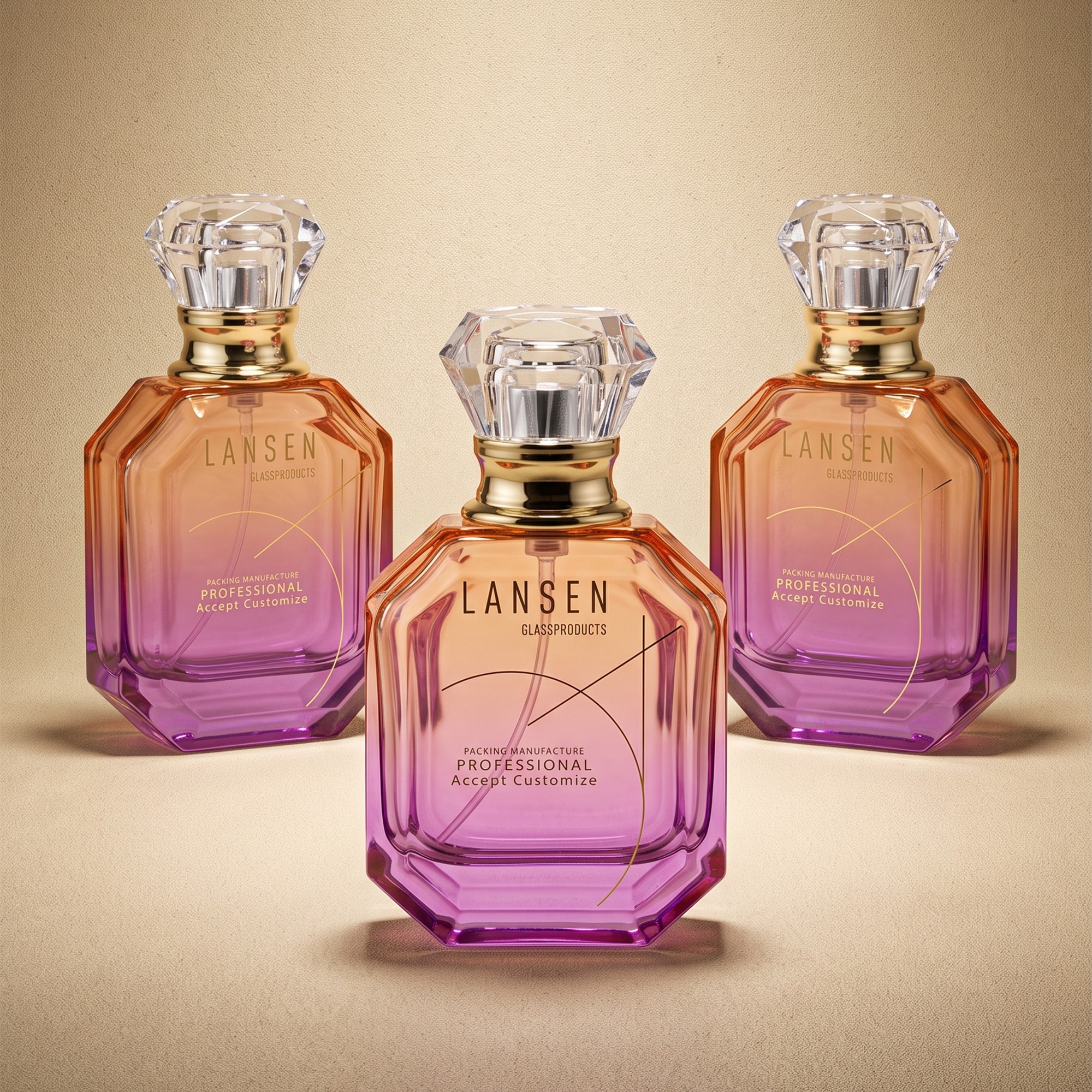 three 50ml faceted glass perfume bottles with amber to purple gradient finish and transparent crystal style caps on gold tone collars