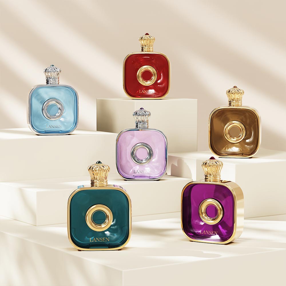 six 50ml flat square perfume bottles in light blue, red, lavender, olive gold, teal and purple displayed on white plinths