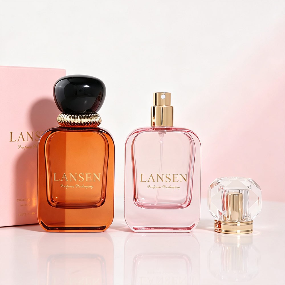 50ml amber and pink flat square perfume bottles shown with a faceted acrylic cap and a pink gift box printed in gold