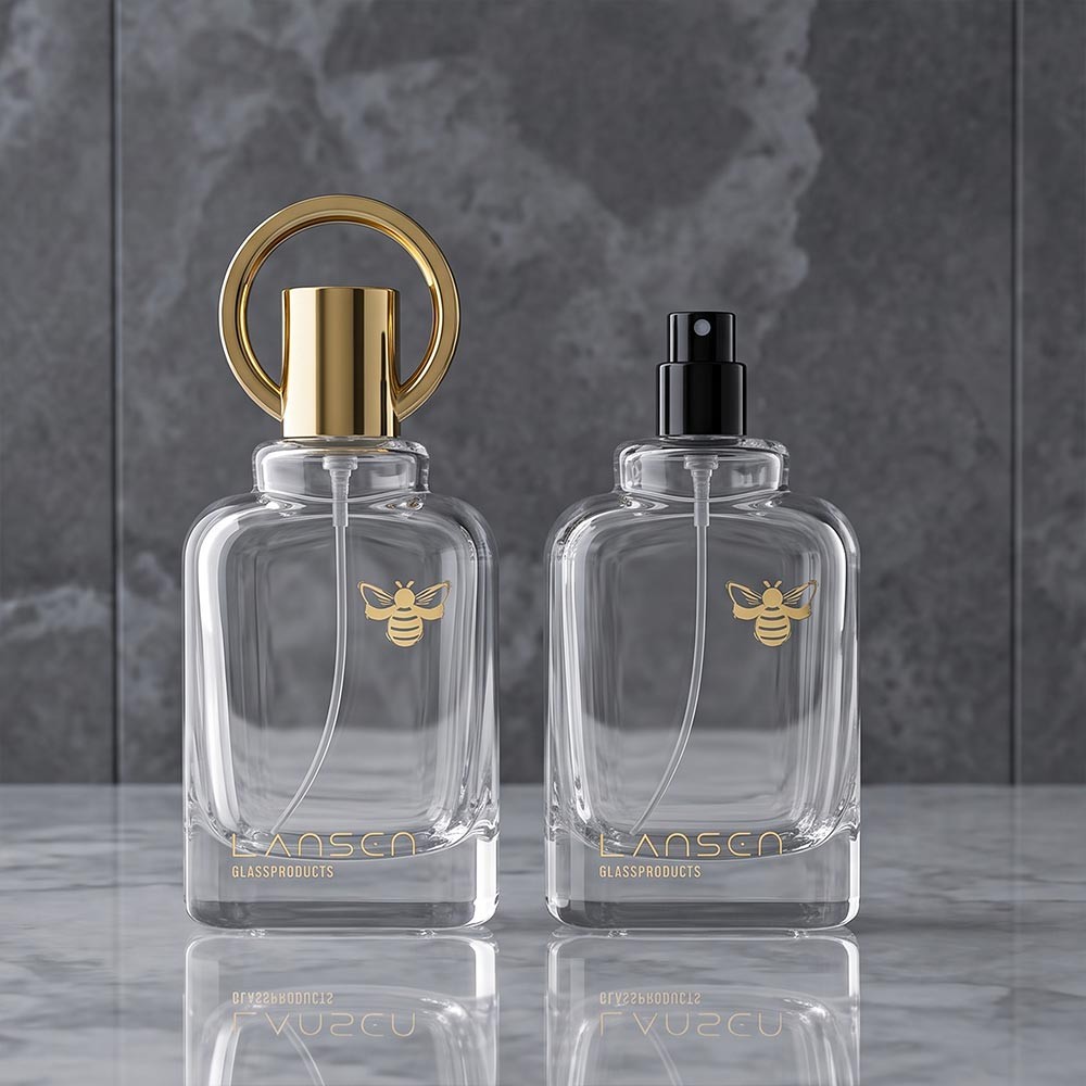 Hot Stamping Cosmetic Bottles: Foil Types, Cost & MOQ Guide 2 50ml clear glass perfume bottle with a gold ring cap and a small gold bee motif on the glass