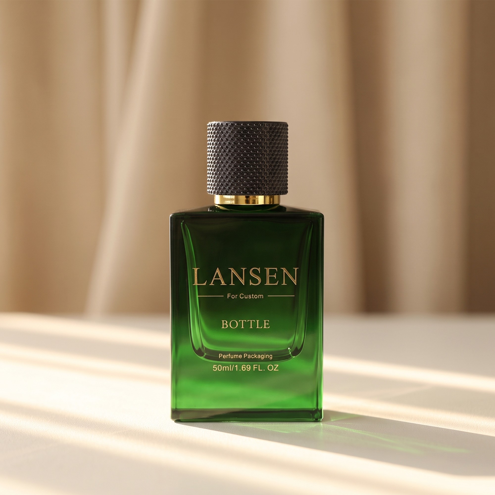 50ml green rectangular cologne bottle with a knurled black cap on a gold collar in warm side light