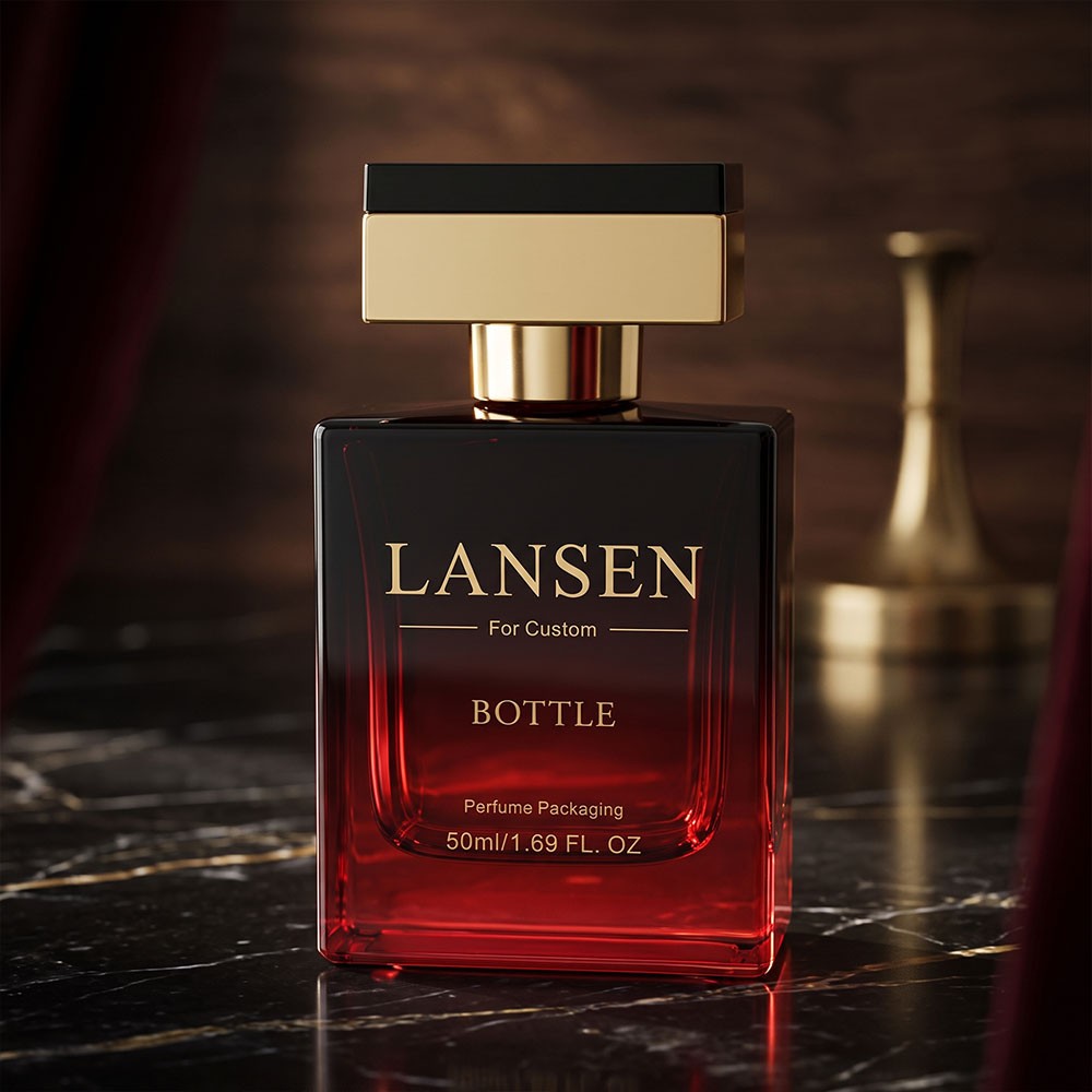 three 50ml rectangular cologne bottles in green blue and red glass with different caps on black plinths