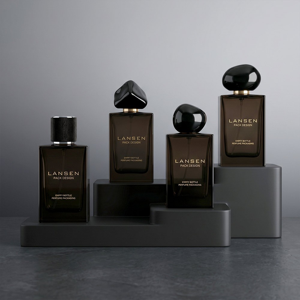 four 50ml smoky brown rectangular perfume bottles shown with cylindrical, gem, ball and round caps on grey display plinths