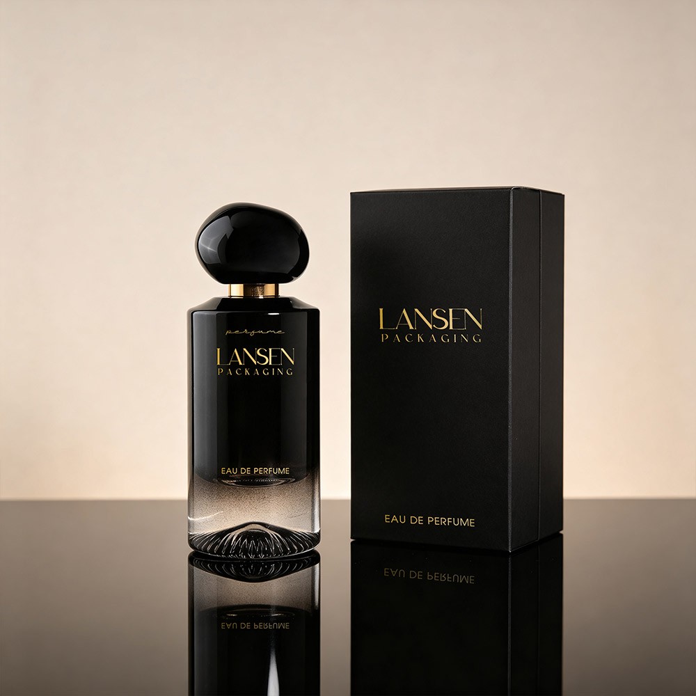 55ml black gradient glass perfume bottle with a flattened spherical cap standing beside a matte black gift box on a reflective surface