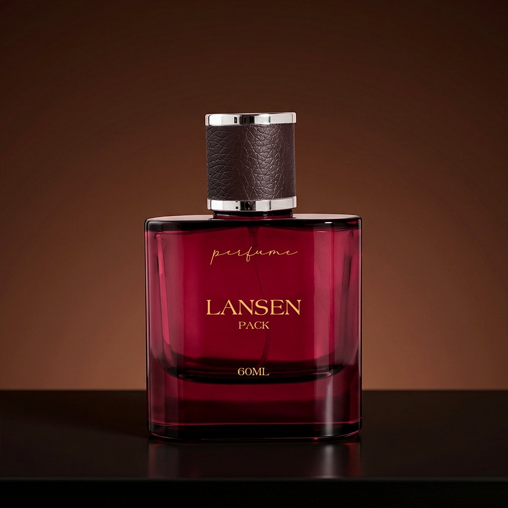 60ml rounded corner red perfume bottle with a dark brown grained leather cap finished with silver rings