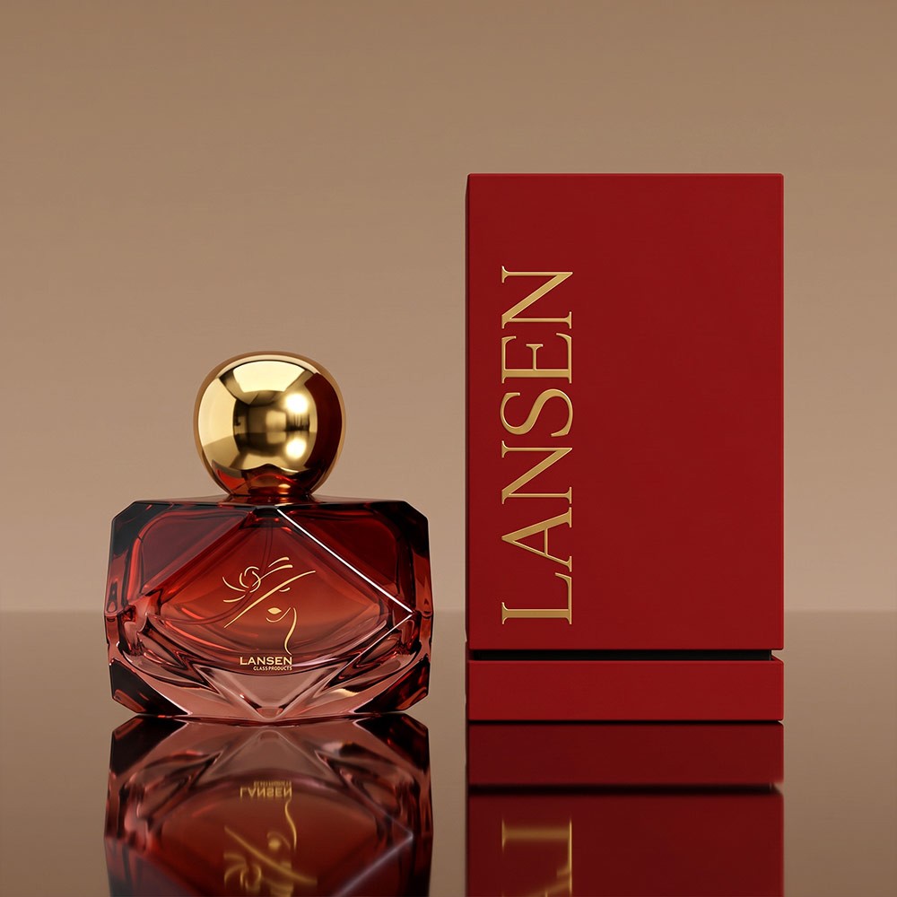 80ml diamond cut glass perfume bottle in deep red with a gold ball cap beside a matching red gift box