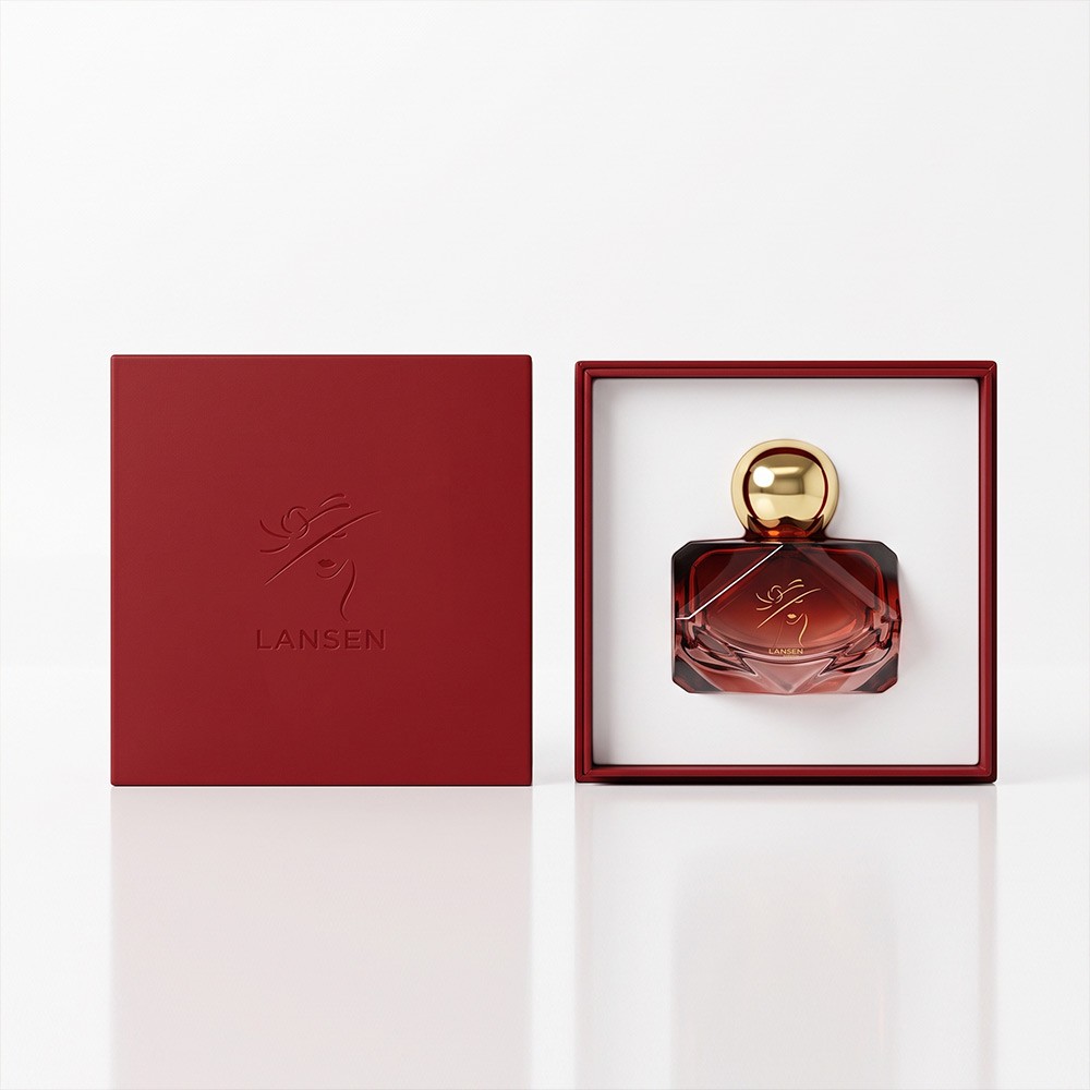 80ml diamond cut perfume bottle nested in a white insert tray inside a red box, shown with the embossed lid alongside