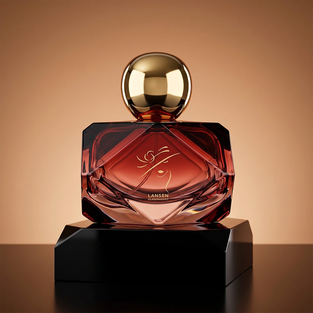 80ml diamond cut perfume bottle in red with a gold ball cap standing on a black faceted plinth