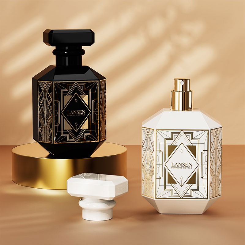 black and white 80ml octagonal perfume bottles with geometric panel prints standing on a gold platform