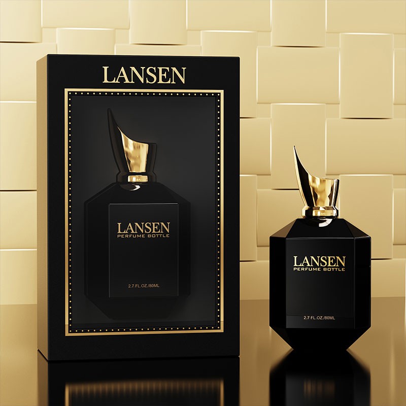 black 80ml octagonal perfume bottle with a pointed gold cap beside a matching gift box printed with the brand logo