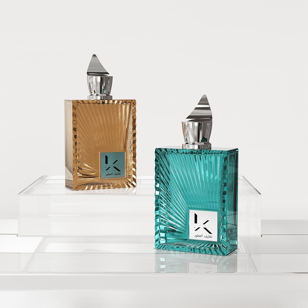 amber and teal rectangular glass perfume bottles with sunburst ray relief and pointed caps on a clear acrylic display stand