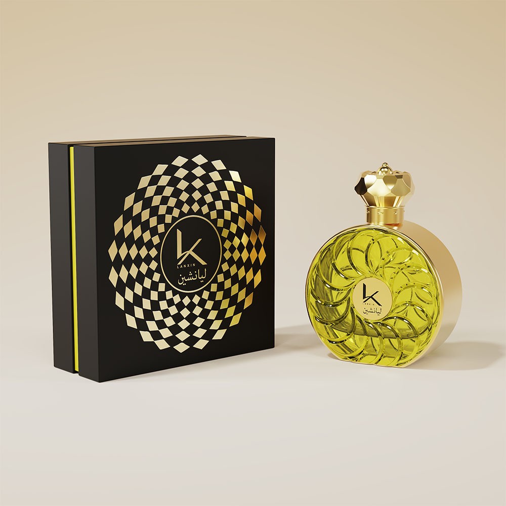 black rigid gift box with a gold geometric medallion beside an olive round perfume bottle with spiral pattern