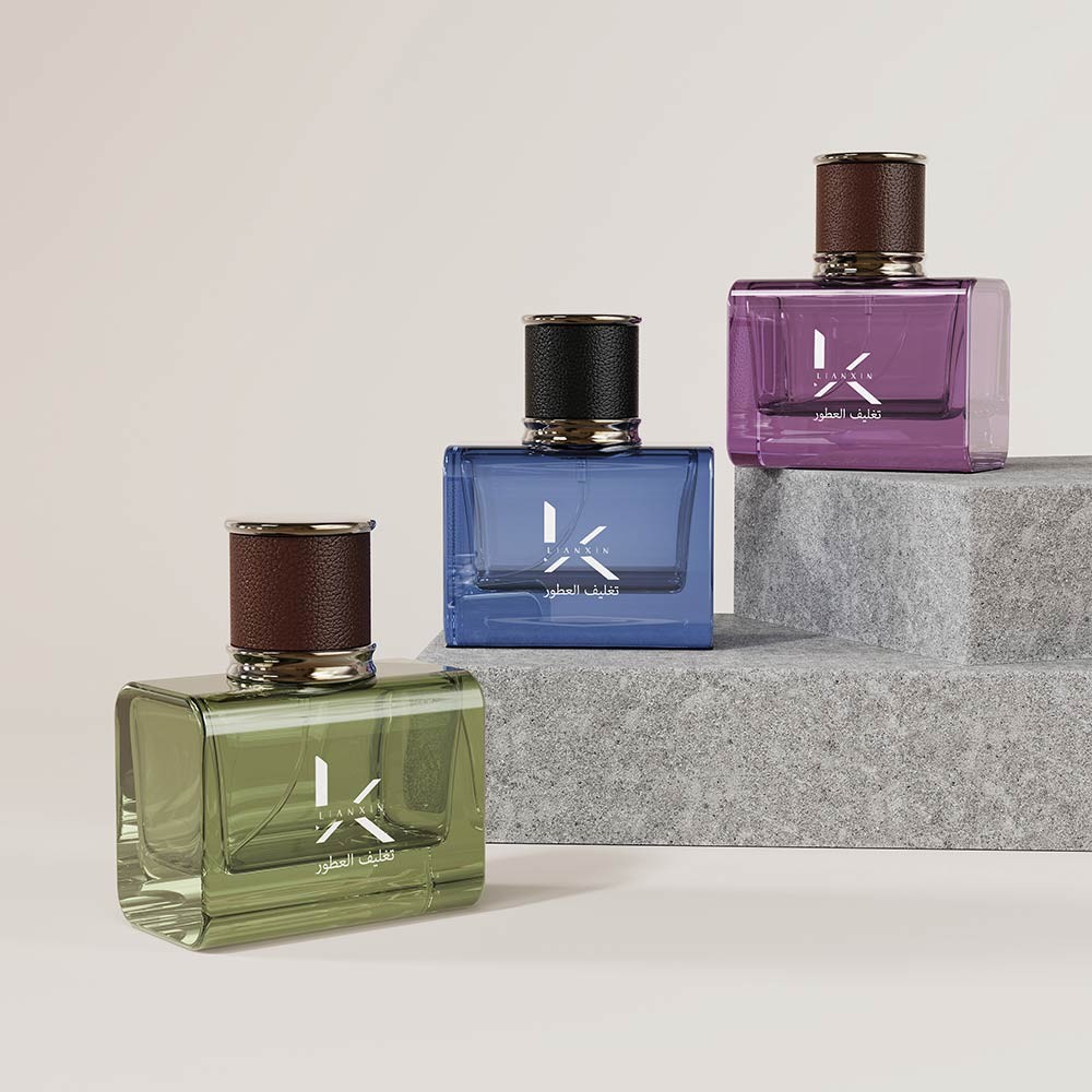 clear coloured square perfume bottles with rounded shoulders in green, blue and purple