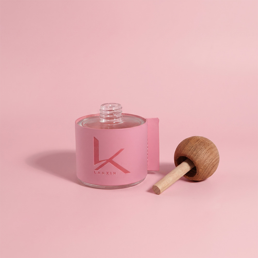 50ml leather wrapped glass reed diffuser bottle in pink with wooden ball cap