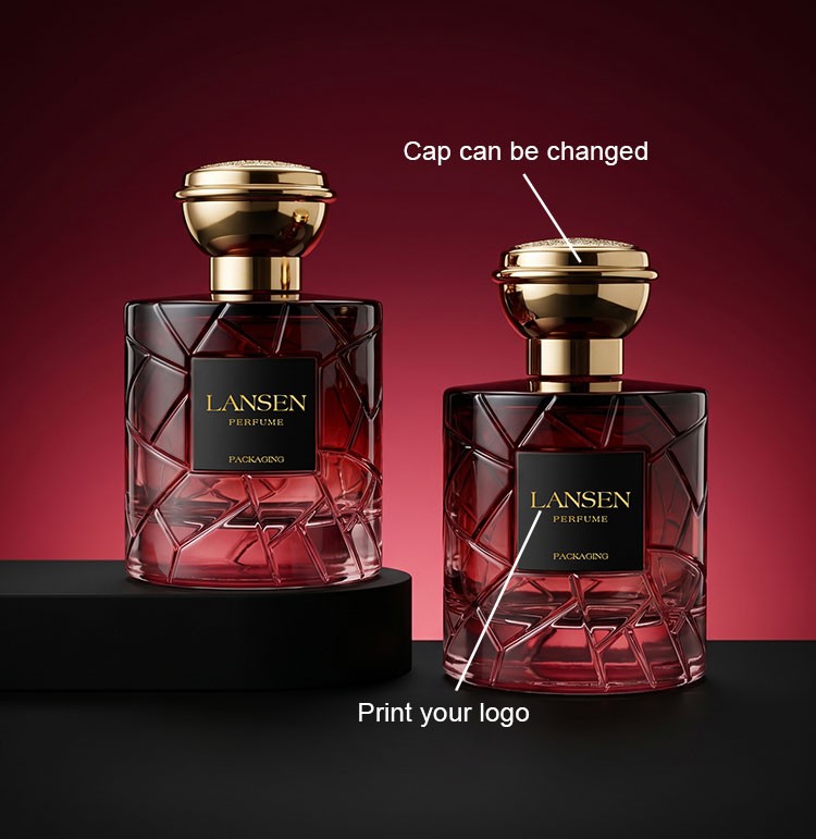 two custom crystal cut perfume bottles showing a changeable gold plated cap and a printed brand logo