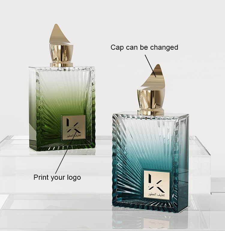 custom gold rectangular perfume bottle showing a changeable pointed cap and printed logo inside the recessed front panel