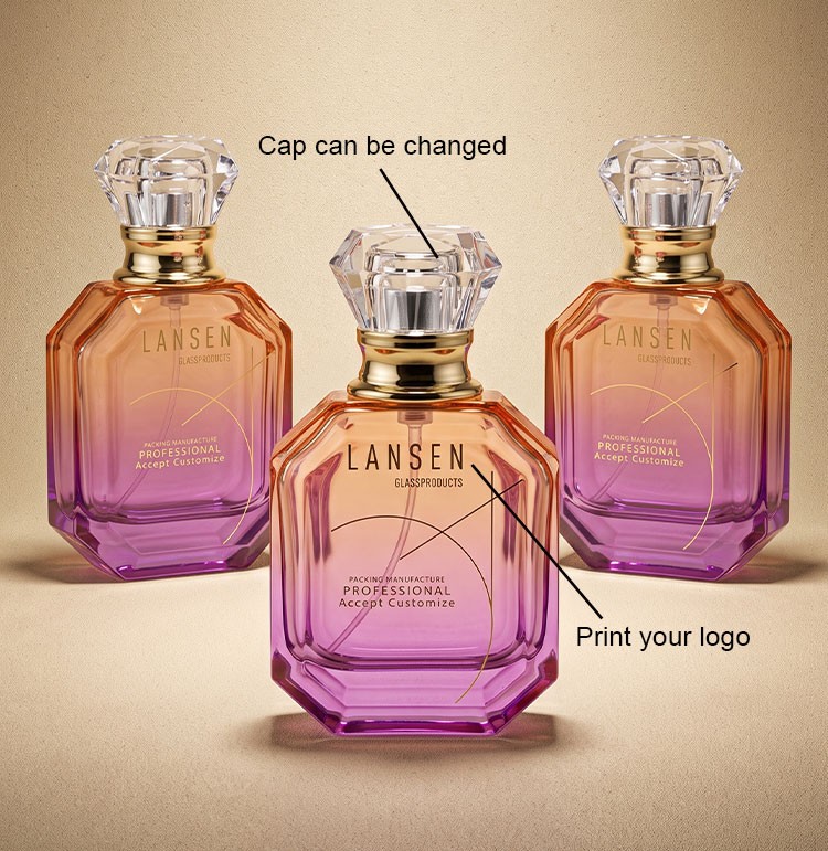 custom gradient glass perfume bottles showing a changeable crystal style cap and a printed brand logo on a gold tone collar