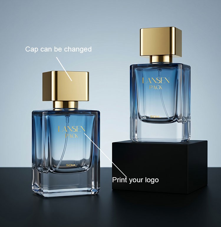 two custom rectangular blue cologne bottles with gold plated square caps showing a changeable cap and a printed brand logo