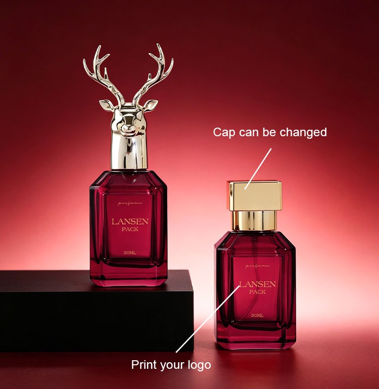 two custom rectangular perfume bottles showing a stag head cap and a changeable square cap with a printed brand logo