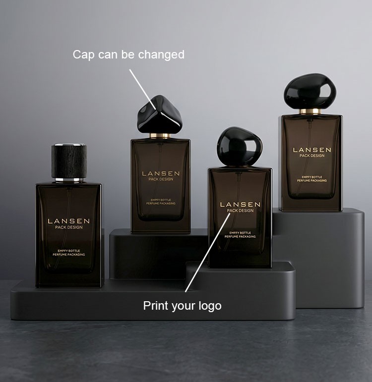 custom smoky brown perfume bottles showing a changeable faceted cap and a printed brand logo across four cap profiles