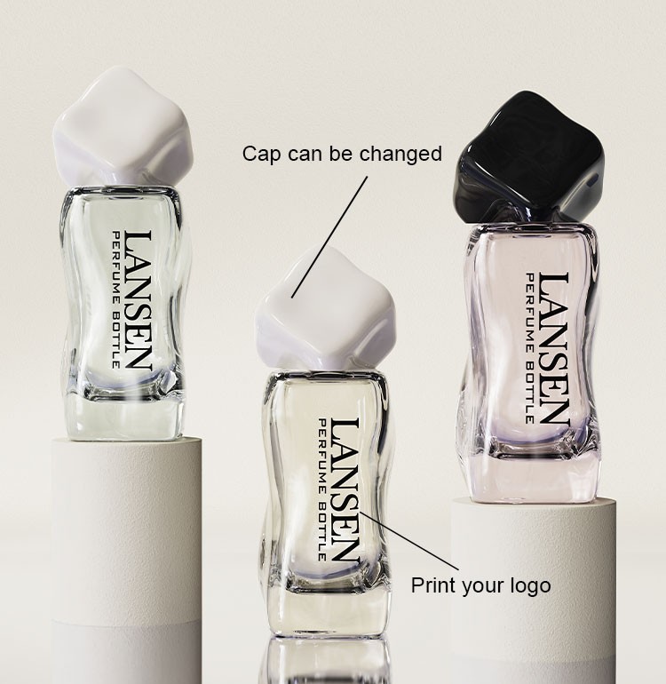 custom wavy shaped perfume bottles with white and black caps showing a changeable cap and a printed logo