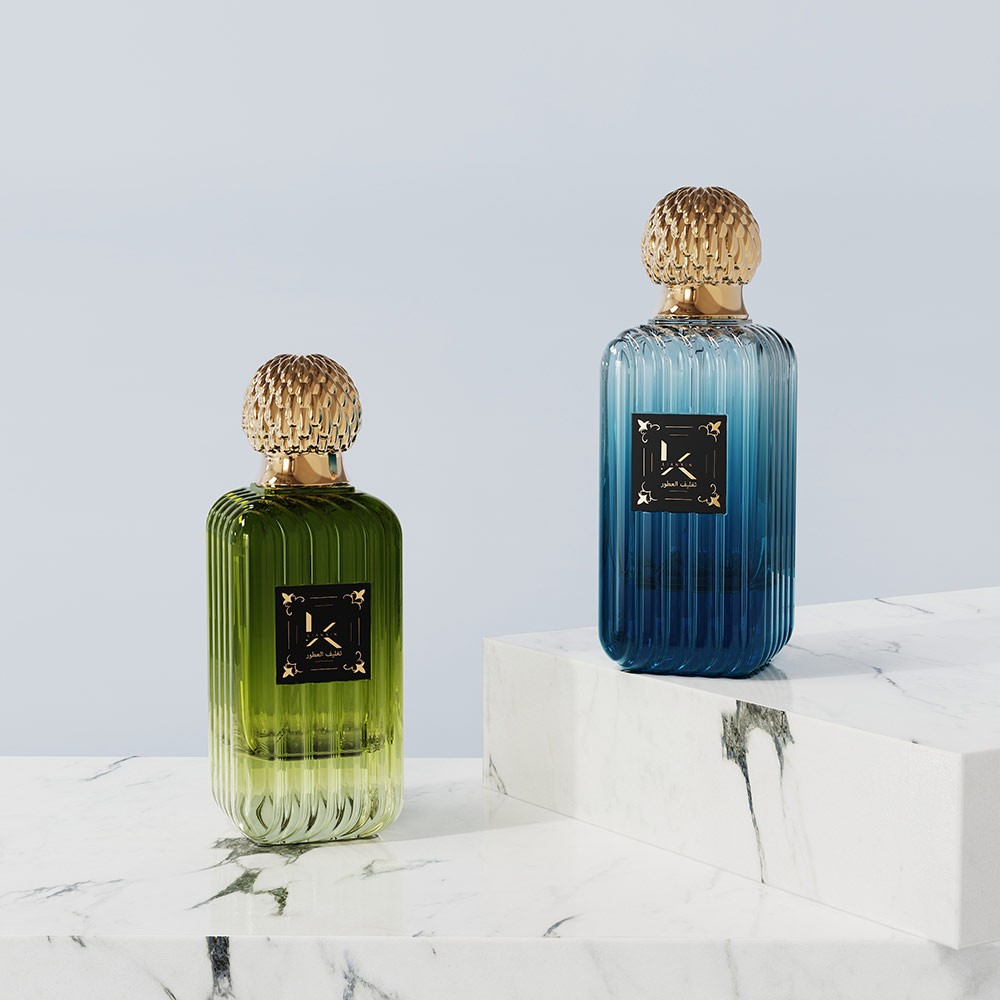 gradient ribbed rectangular glass perfume bottles fading from green to blue with gold fluted plastic caps