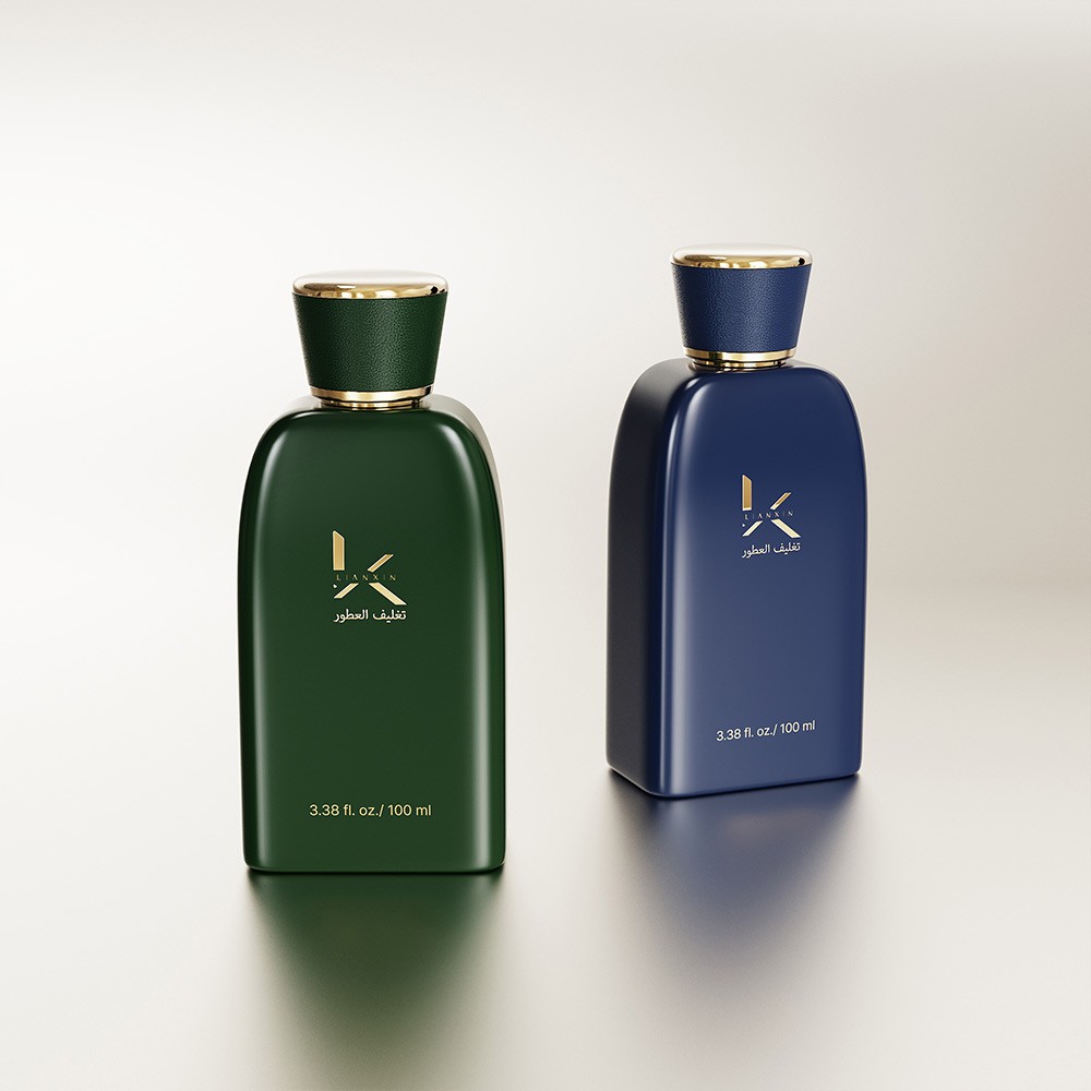 dark green and navy blue sloped shoulder perfume bottles with colour matched leather covered caps and gold collars