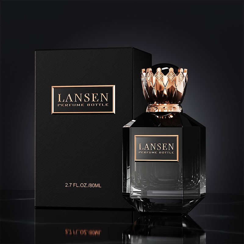 black 80ml octagonal perfume bottle with a rose gold crown shaped cap beside a rigid gift box