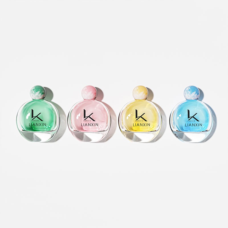 round perfume bottles with marbled ball caps in mint green, pink, yellow and blue